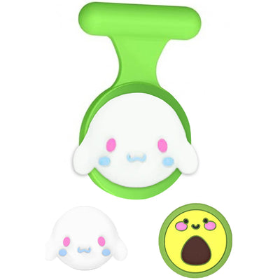 Green ghost plastic cookie cutter with white face and blue eyes for AirTag holder