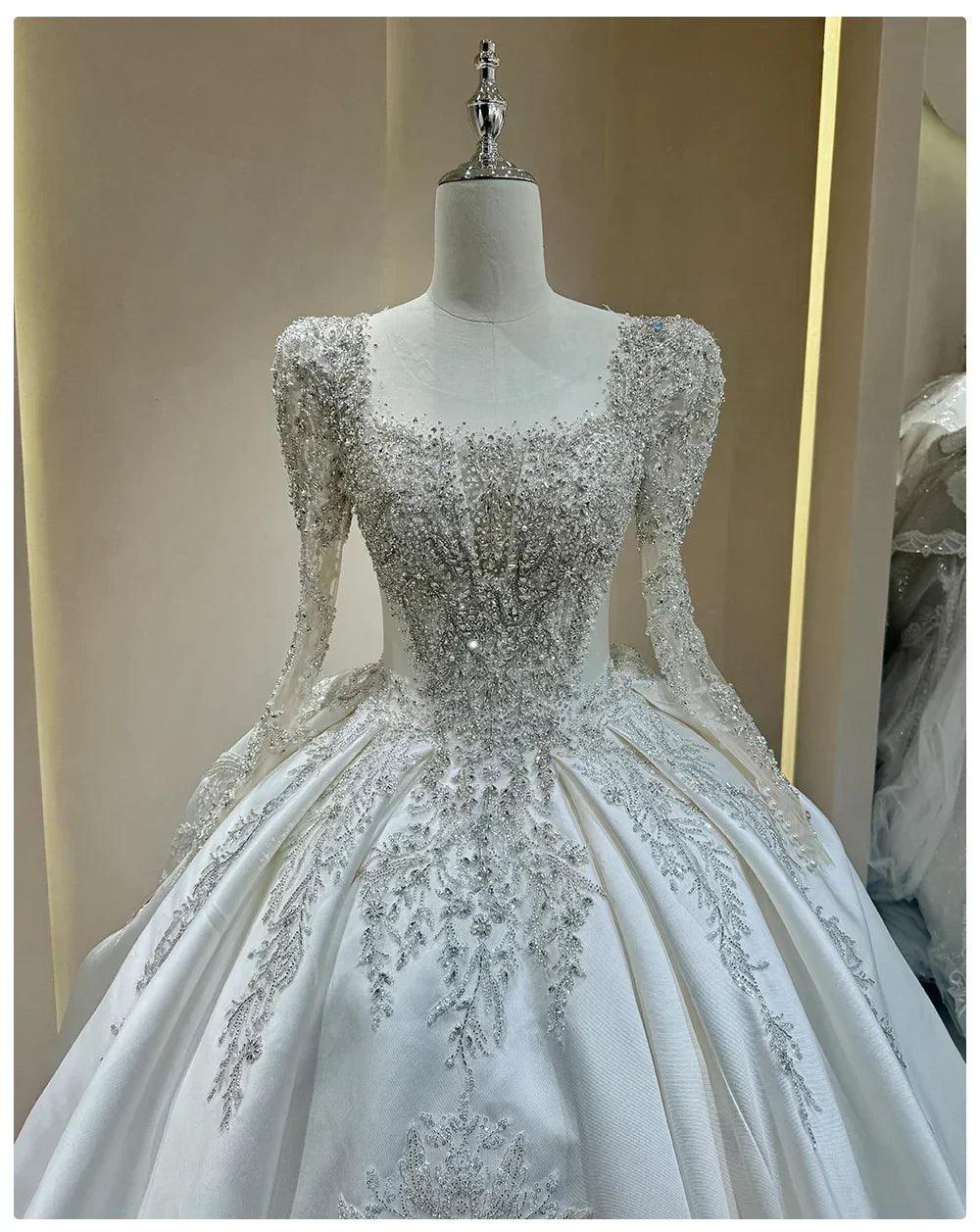 Wedding dress with sparkling embellishments and long trains delicate lace