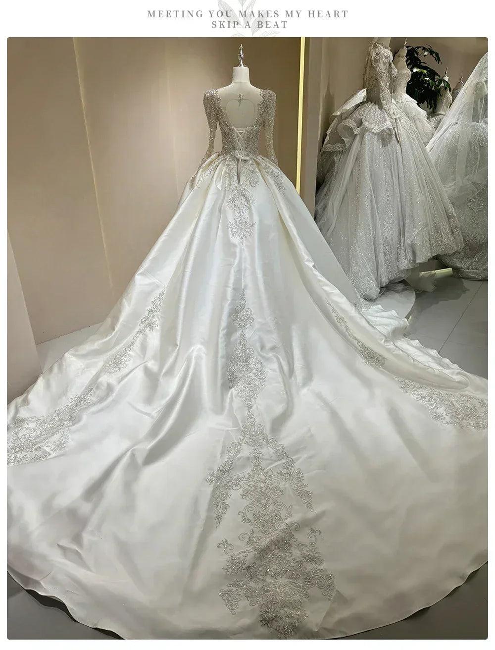 Wedding dress with sparkling embellishments and long trains delicate lace