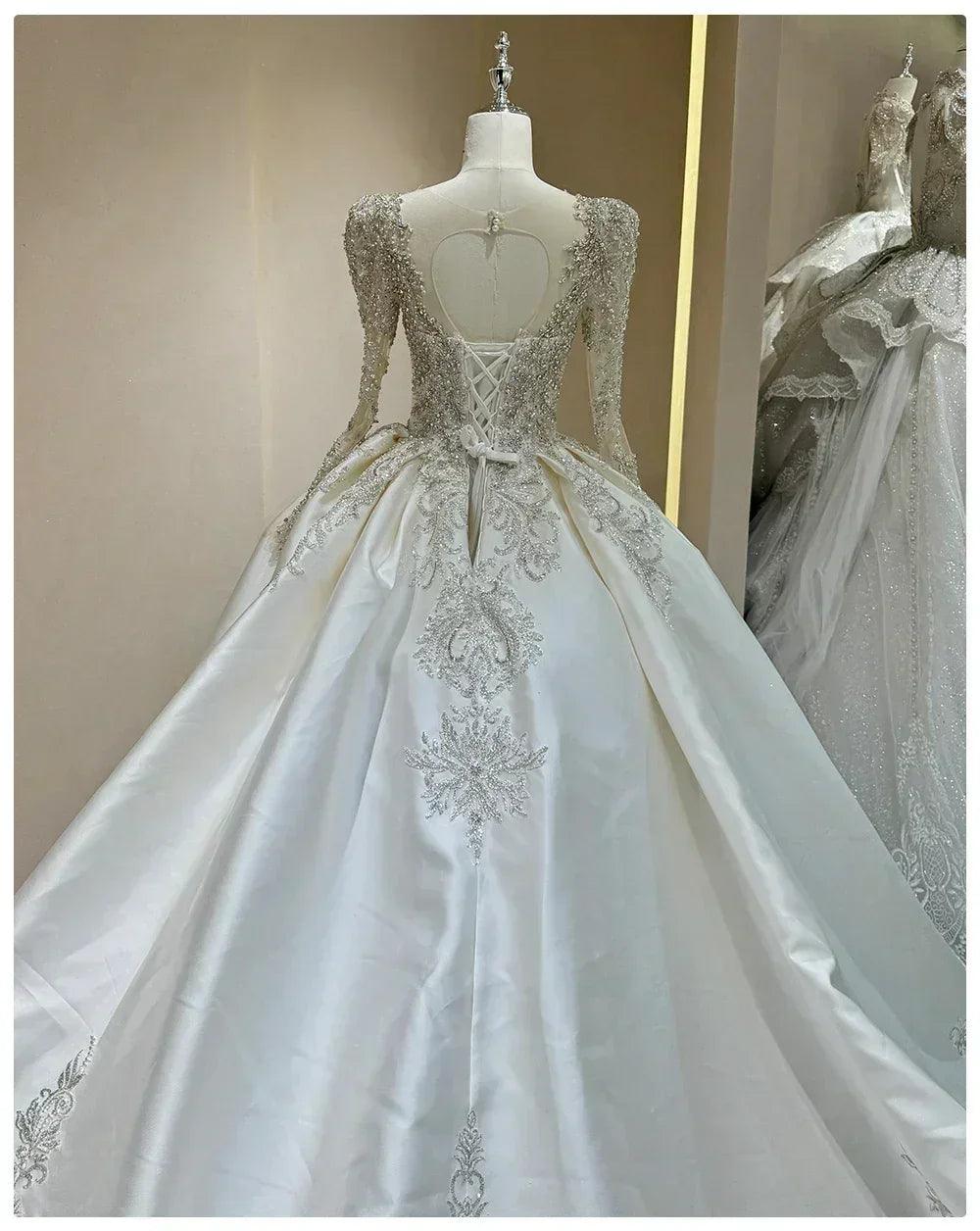 Wedding dress with sparkling embellishments and long trains delicate lace