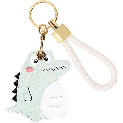 Mint green dinosaur AirTag holder with white leather hand straps