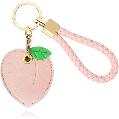 Pink peach AirTag leather keychain with hand straps and green leaf charm
