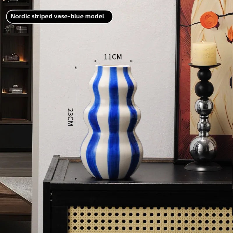 Modern niche minimalist striped vases, flower arrangements in them, high-end sense, creative retro painted ceramic vases