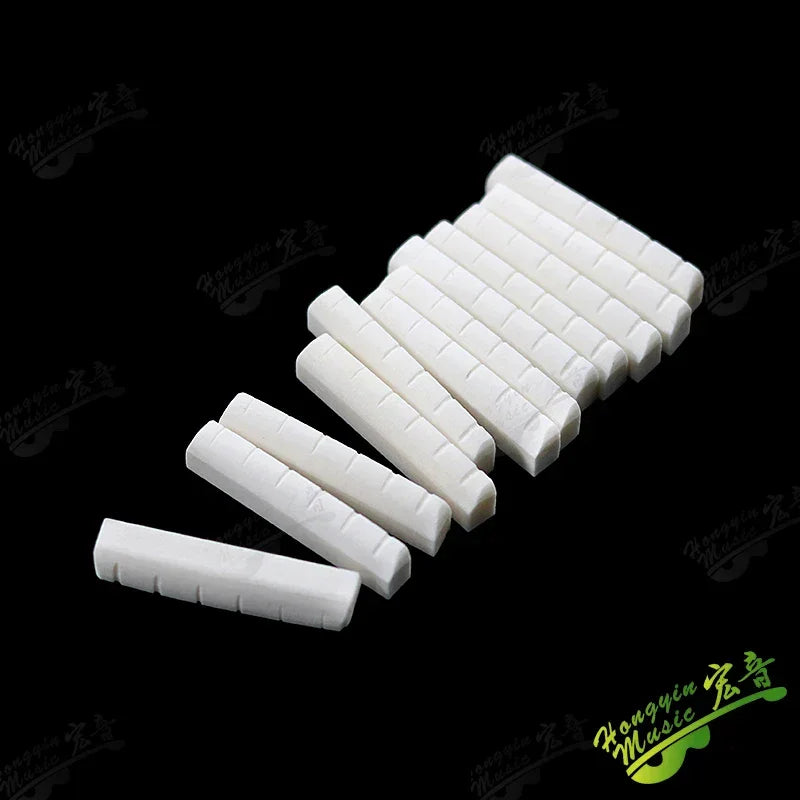 Acoustic guitar  and 4 5 6 7 12String Bass guitar nut slotted, upper and lower nuts slotted in various sizes Made of Bovine bone