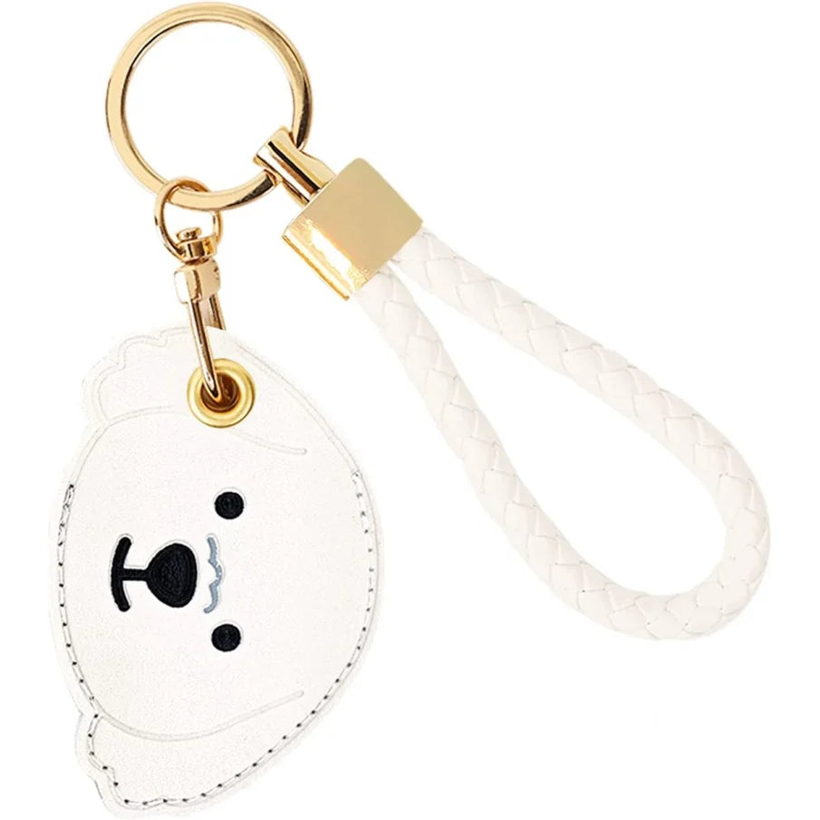 White bear face AirTag leather keychain with hand straps and gold hardware