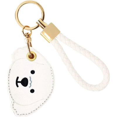 White bear face AirTag leather keychain with hand straps and gold hardware