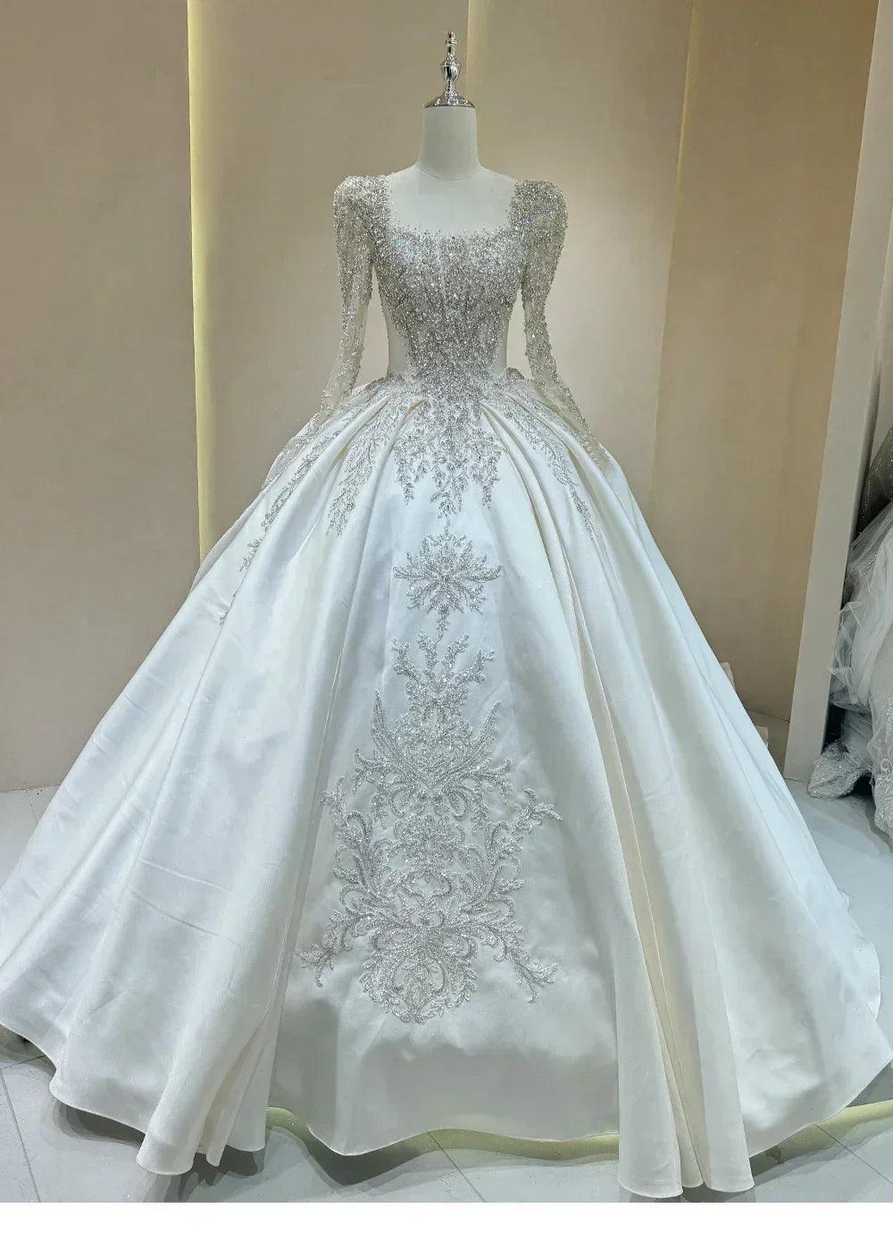 Wedding dress with sparkling embellishments and long trains delicate lace