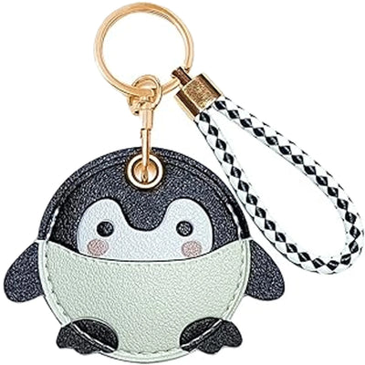 Penguin-shaped faux leather AirTag keychain with hand straps, mint green and black accents