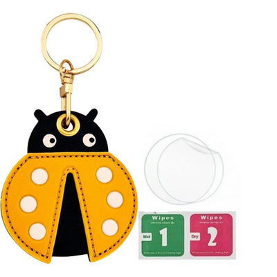 Yellow ladybug AirTag leather keychain holder with hand straps and gold hardware