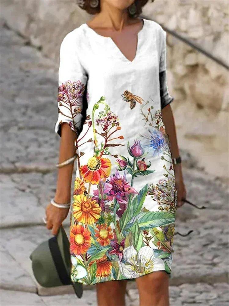 Vestido feminino de algodão com estampa floral colorida.