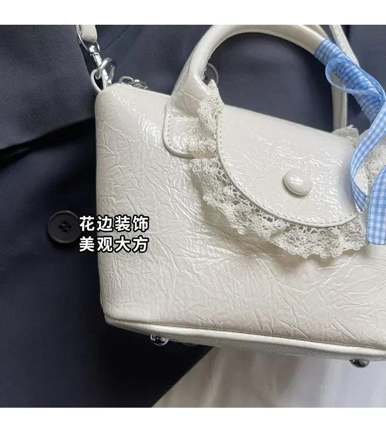 2025 new designer hand carved shoulder bag stylish textured crossbody purse for women elegant handheld tote fashionable