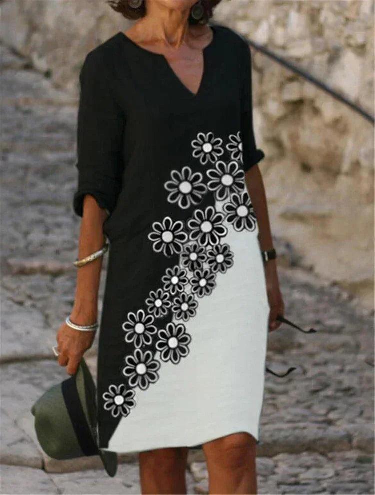 Vestido feminino de algodão com estampa floral colorida.